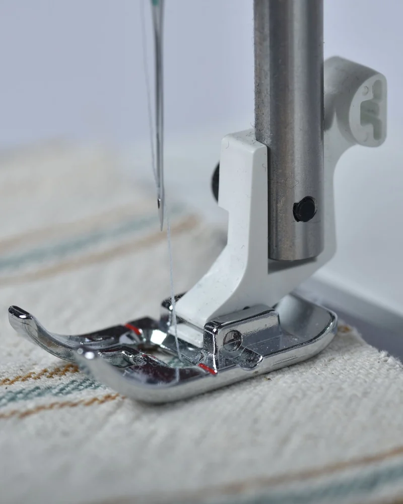 Sewing machine stitching a seam