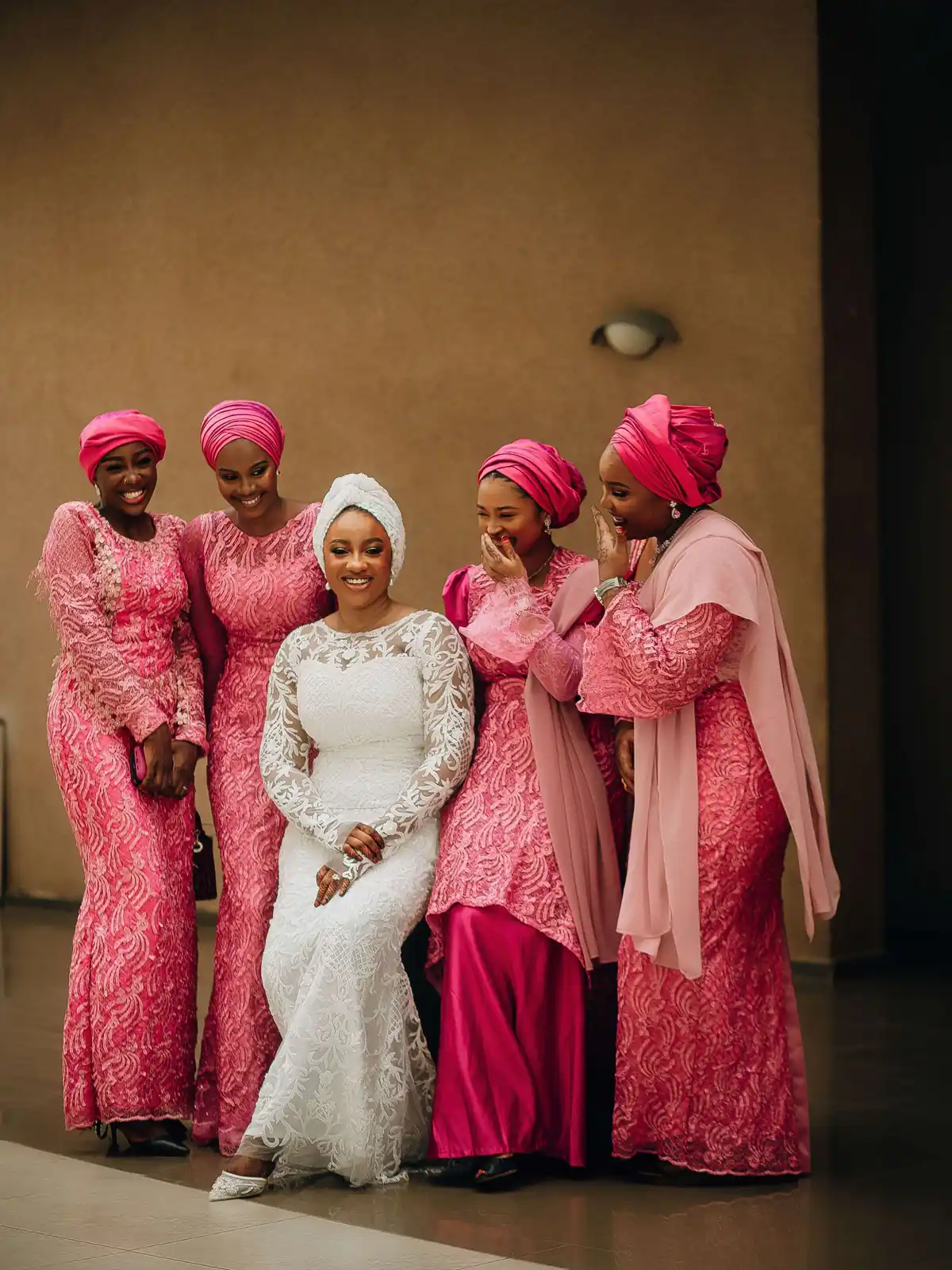Bridesmaids in matching dusty-rose dresses